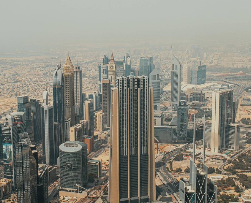 A private wealth management consultation in a modern Dubai office, focusing on strategic financial planning.